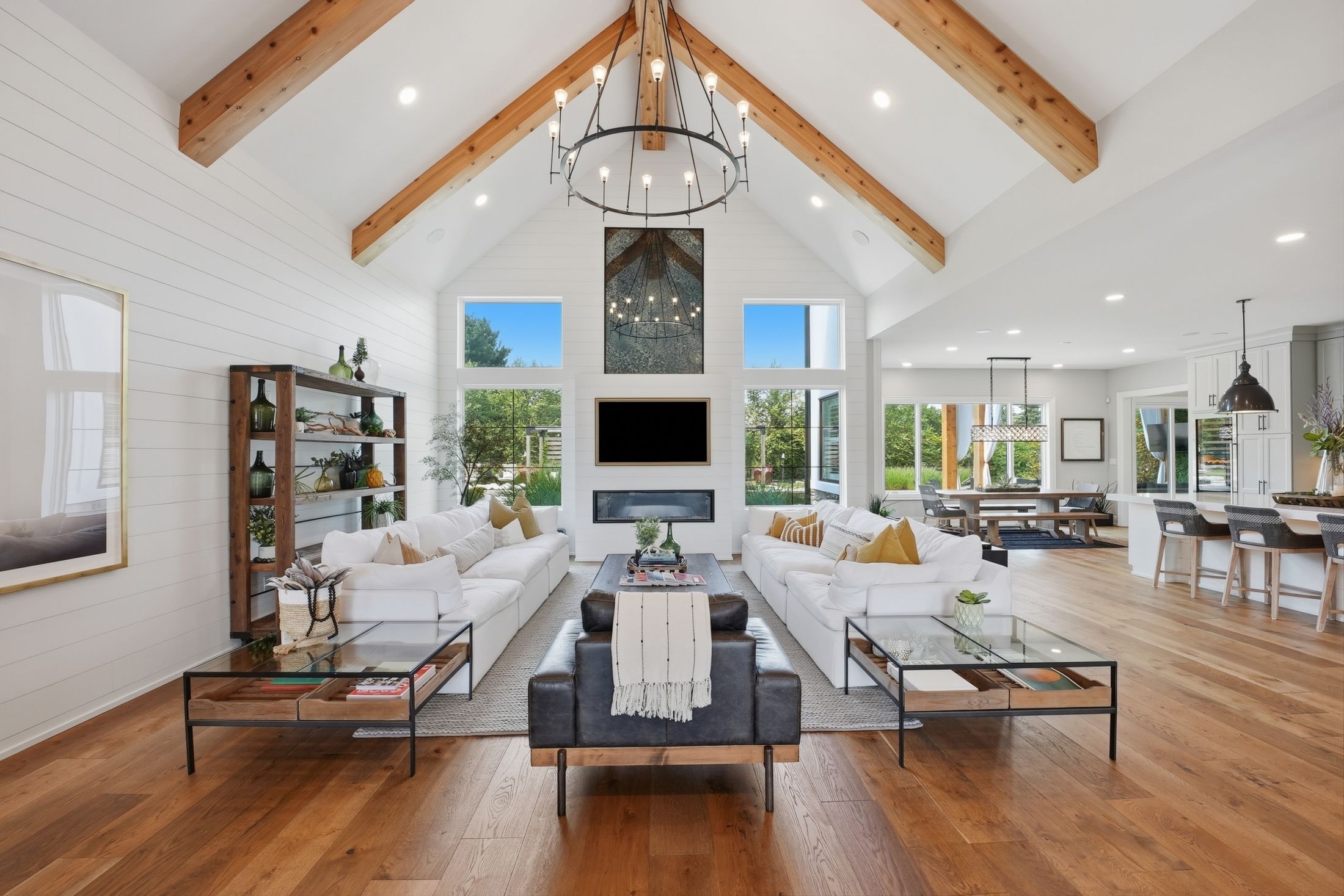 Vaulted great room with custom oak beams and wall of windows