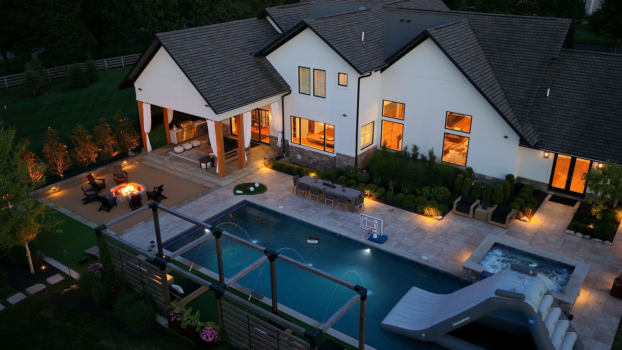 Deck jets and fire pit at dusk